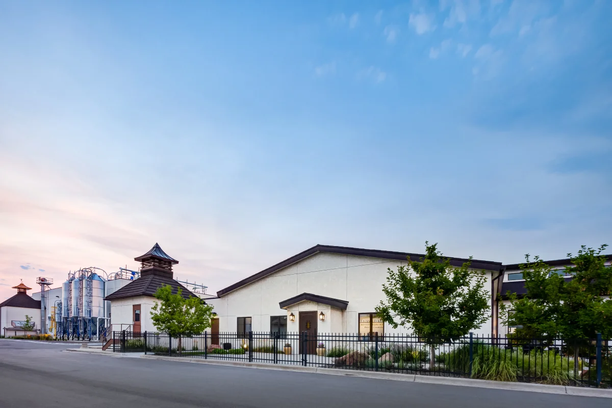 Leopold Bros. Small Batch Distillers campus exterior at dusk in Denver, Colorado