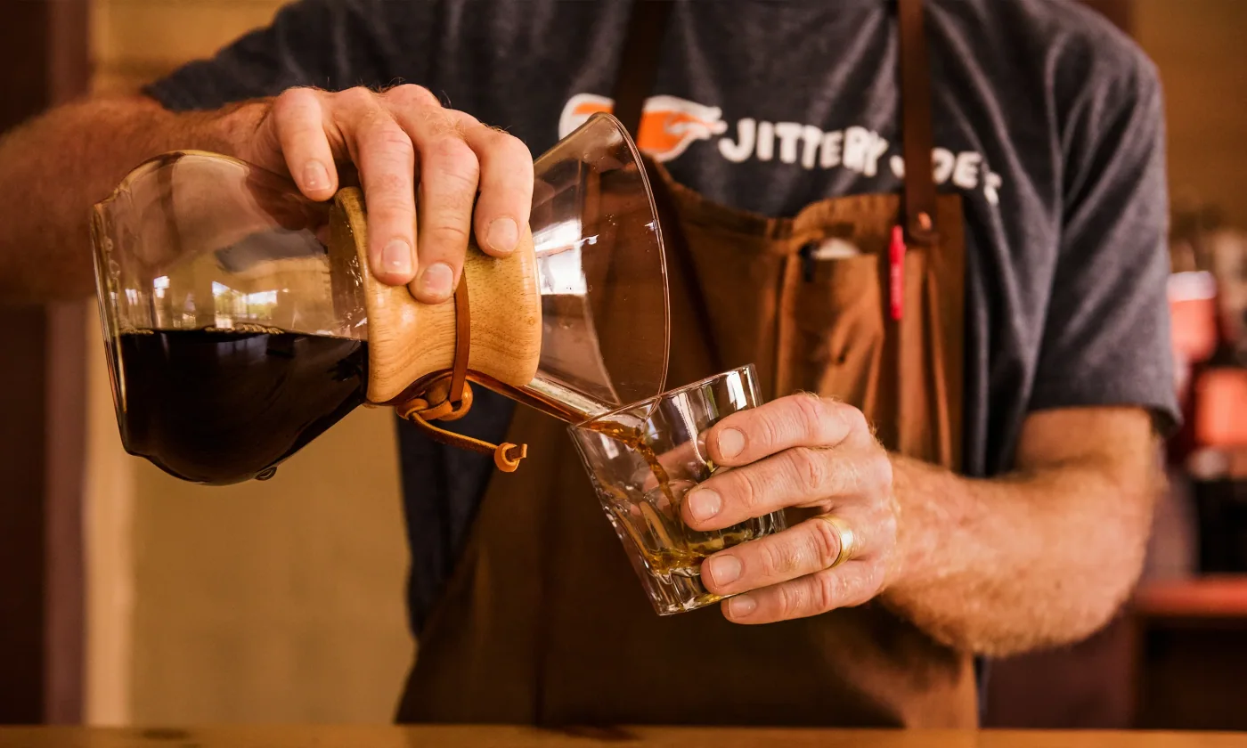 Jittery Joe's pour-over preparation — the craft-coffee side of the Athens roastery Googe has built since 2002
