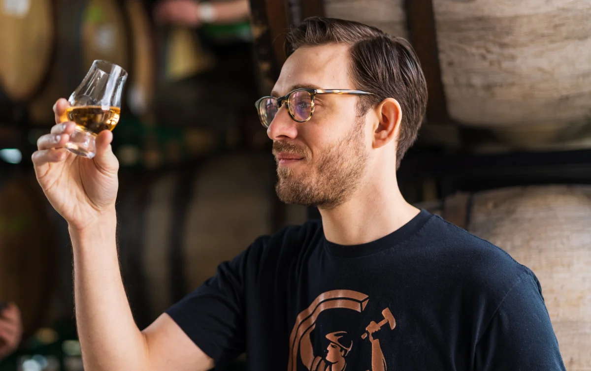 Jeff Kanof nosing a whiskey at Copperworks Distilling Co. in Seattle